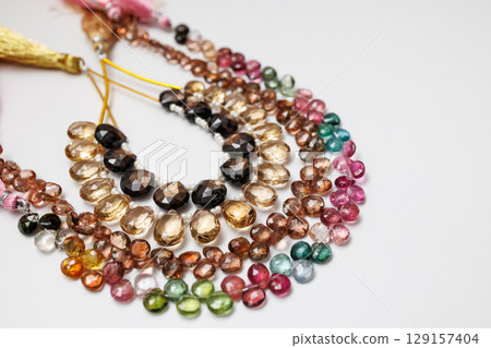 Colorful natural stone beads | Close-up photos of autumn-colored jewelry parts Colorful natural stone beads | Close-up photos of autumn-colored jewelry parts 129157404
