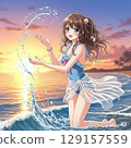 Cute high school girl playing in the water on the beach at sunset 129157559