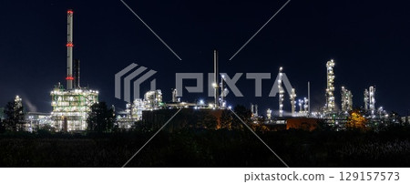 night time silhouette of oil refinery Schwedt producing fuel from russian oil pipe druschba night time silhouette of oil refinery Schwedt producing fuel from russian oil pipe druschba 129157573