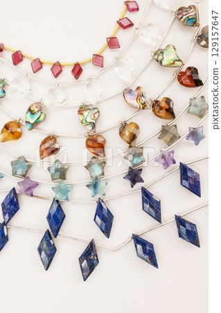 Collection of natural stone beads cut into heart, star, and diamond shapes | Jewelry material image 129157647