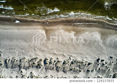 topdown drone view of a baltic sandy beach topdown drone view of a baltic sandy beach 129157655