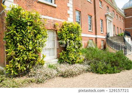 Osterley House, a historic red brick building in Osterley Park, a suburb of London Osterley House, a historic red brick building in Osterley Park, a suburb of London 129157721