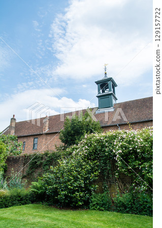 A historic brick building with a weathervane tower in Osterley Park, a suburb of London A historic brick building with a weathervane tower in Osterley Park, a suburb of London 129157722