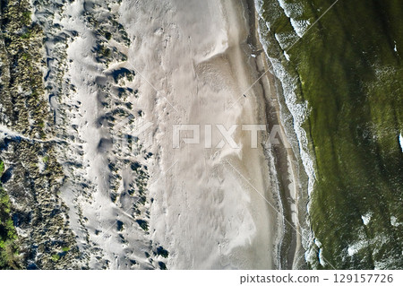 topdown drone view of a baltic sandy beach 129157726