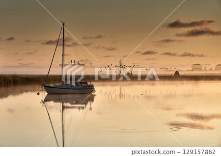 boat scenery on a foggy morning at baltic sea 129157862