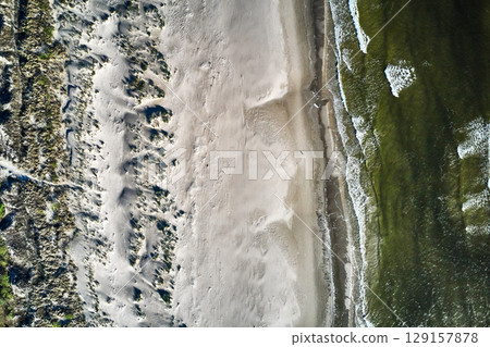topdown drone view of a baltic sandy beach topdown drone view of a baltic sandy beach 129157878