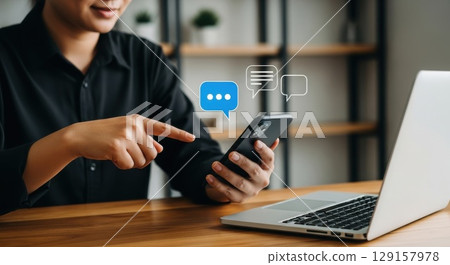 online shopping theme with man using a smartphone 129157978