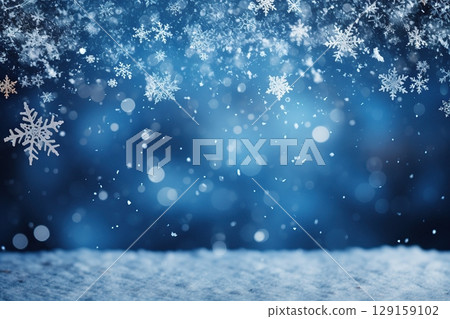 Snowflakes drift gracefully through the air, creating a peaceful winter setting. In the background, a soft blue glow enhances the serene atmosphere as evening approaches. 129159102