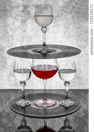 Still life with a glass of red wine with vinyl records 129159372