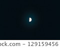Half moon floating in the darkness 129159456