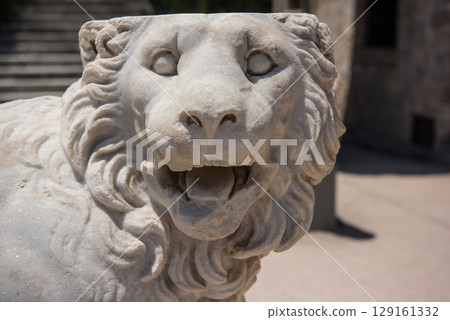 Lion sculpture. Greek elements of architectural decorations of buildings, columns Lion sculpture. Greek elements of architectural decorations of buildings, columns 129161332