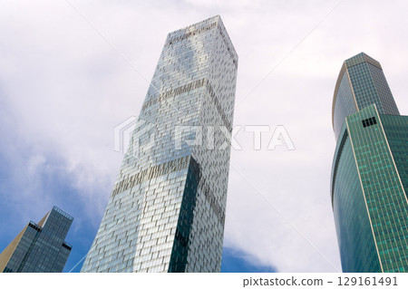 Modern skyscrapers on a blue sky background 129161491