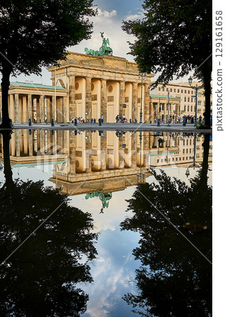 Famous Brandenburger Tor mirroring in a puddle 129161658