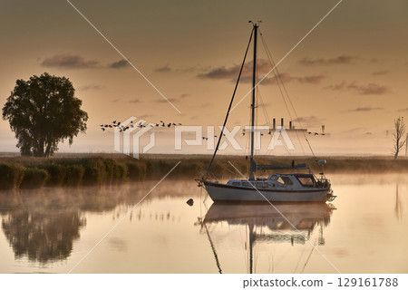 boat scenery on a foggy morning at baltic sea boat scenery on a foggy morning at baltic sea 129161788