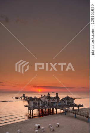 historic Pier of in sunrise mood at baltic sea 129161939