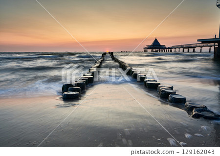 pier of Heringsdorf on German isle of Usedom in sunrise light 129162043