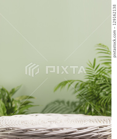 Natural product display for presentation. Empty podium on green background with green leaves. Eco friendly beautiful showcase from natural materials for new product and promotion sale. Vertical format 129162138