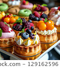 Delicious tarlets with fruit topping. 129162596