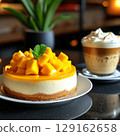 Mango cheesecake and irish coffee. 129162658