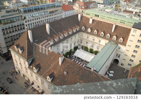 A spectacular view overlooking the red roofs and courtyards of historic buildings A spectacular view overlooking the red roofs and courtyards of historic buildings 129163018