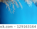Textured background with dry reed stalks on blue, perfectly suitable for presentations. 129163164