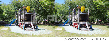 A stereogram that uses cross-eyed stereoscopic vision to recreate the wooden playground equipment and surrounding scenery in a park. 129163347