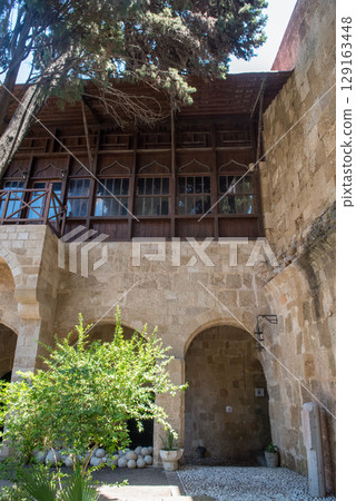 Ancient buildings with flowers on Rhodes island, Greece Ancient buildings with flowers on Rhodes island, Greece 129163448