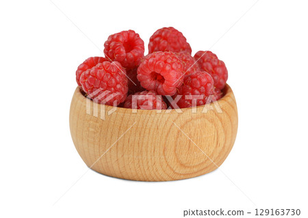 Fresh red raspberries in small wooden bowl isolated on white background. organic healthy food Fresh red raspberries in small wooden bowl isolated on white background. organic healthy food 129163730