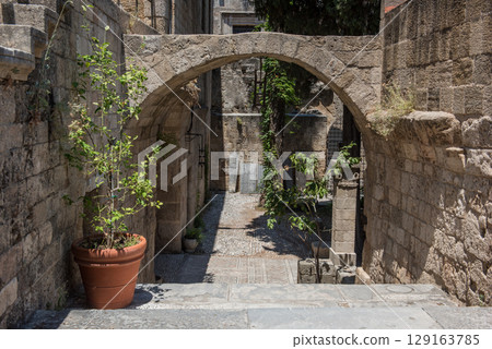 Medieval arched street in the old town of Rhodes, Greece 129163785