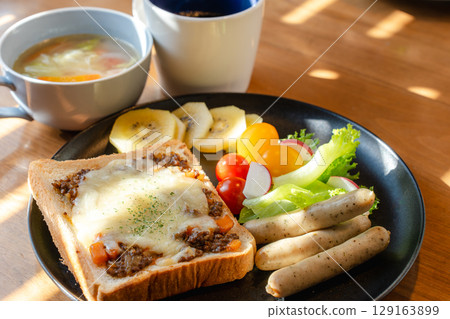A Western-style breakfast set featuring meat toast, sausages, salad, and soup. A Western-style breakfast set featuring meat toast, sausages, salad, and soup. 129163899