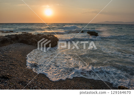 Aegean sea sunset beach sea Rhodes, Greece Aegean sea sunset beach sea Rhodes, Greece 129164670