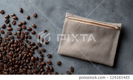 Coffee Beans and Zipper Pouch on Textured Surface 129165485