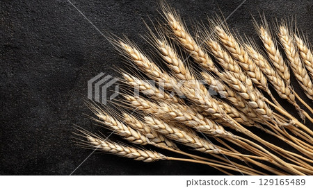 Wheat Spikes on Black Table Flat Lay 129165489