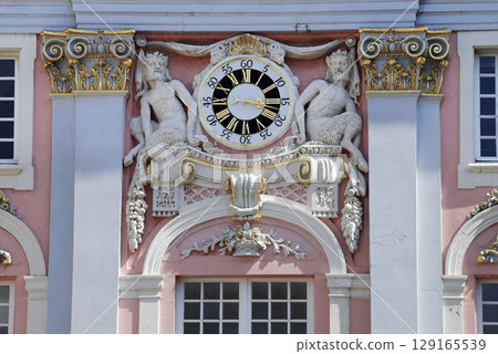 Ancient Clock and centaurs at the fassade of the municipality in Bonn, NRW, Germany 129165539