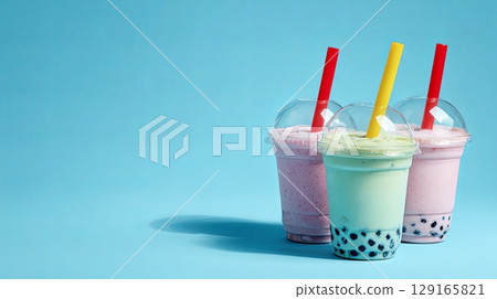 Colorful Bubble Tea Drinks on Blue Background Colorful Bubble Tea Drinks on Blue Background 129165821