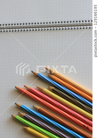 Notes and colored pencils 129166195