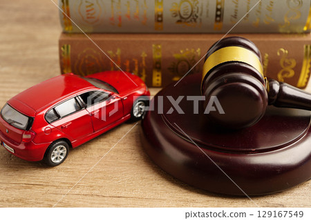 Bangkok, Thailand March 15, 2023 Car accident lawsuit and insurance, Judge hammer with car model. Bangkok, Thailand March 15, 2023 Car accident lawsuit and insurance, Judge hammer with car model. 129167549