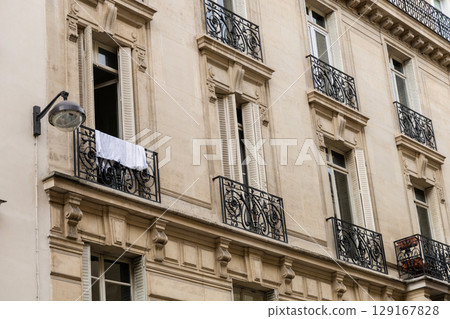 The Elegant and Iconic Parisian Architecture Enhanced by Beautiful Classic Balconies The Elegant and Iconic Parisian Architecture Enhanced by Beautiful Classic Balconies 129167828
