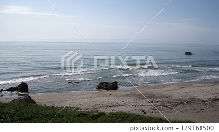 A beach where whitecaps crash 129168500