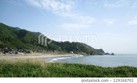 Summer blue sky, green mountains and white waves of the sea Summer blue sky, green mountains and white waves of the sea 129168701