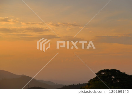 Sunset sky, clouds, mountains, trees Sunset sky, clouds, mountains, trees 129169145
