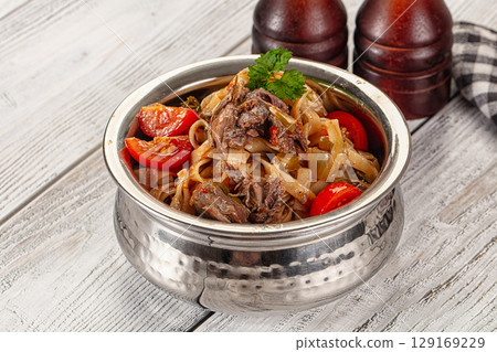 Asian udon noodles with beef 129169229