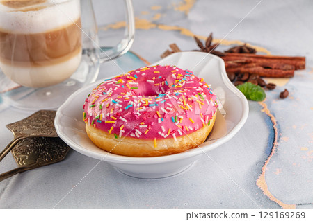 Sweet donut with strawberry icing 129169269