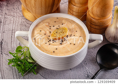Tasty cheese cream soup with crouton 129169409
