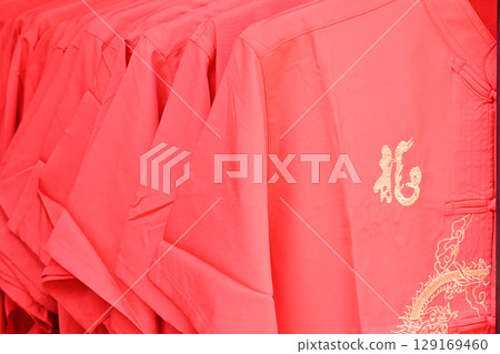 red shirt hang on cloth rack in Chinese new year festival red shirt hang on cloth rack in Chinese new year festival 129169460