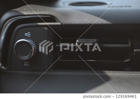 interior view of car with black leather, closeup car air conditional vents interior view of car with black leather, closeup car air conditional vents 129169461