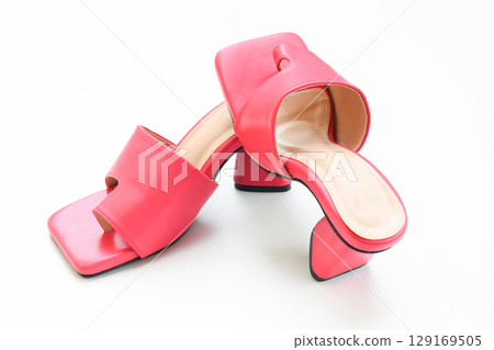 beautiful pink leather heel shoe isolated on white background beautiful pink leather heel shoe isolated on white background 129169505