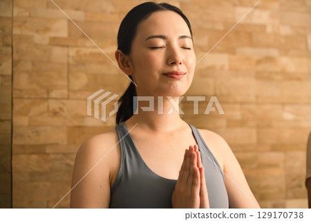 Young woman doing hot yoga beauty image 129170738