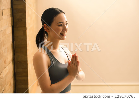 Young woman doing hot yoga beauty image 129170763