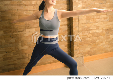 Young woman doing hot yoga beauty image 129170767
